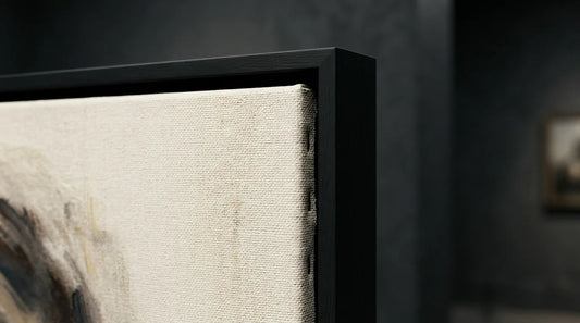 Close detail of a canvas in a black floater frame showing the shadow gap
