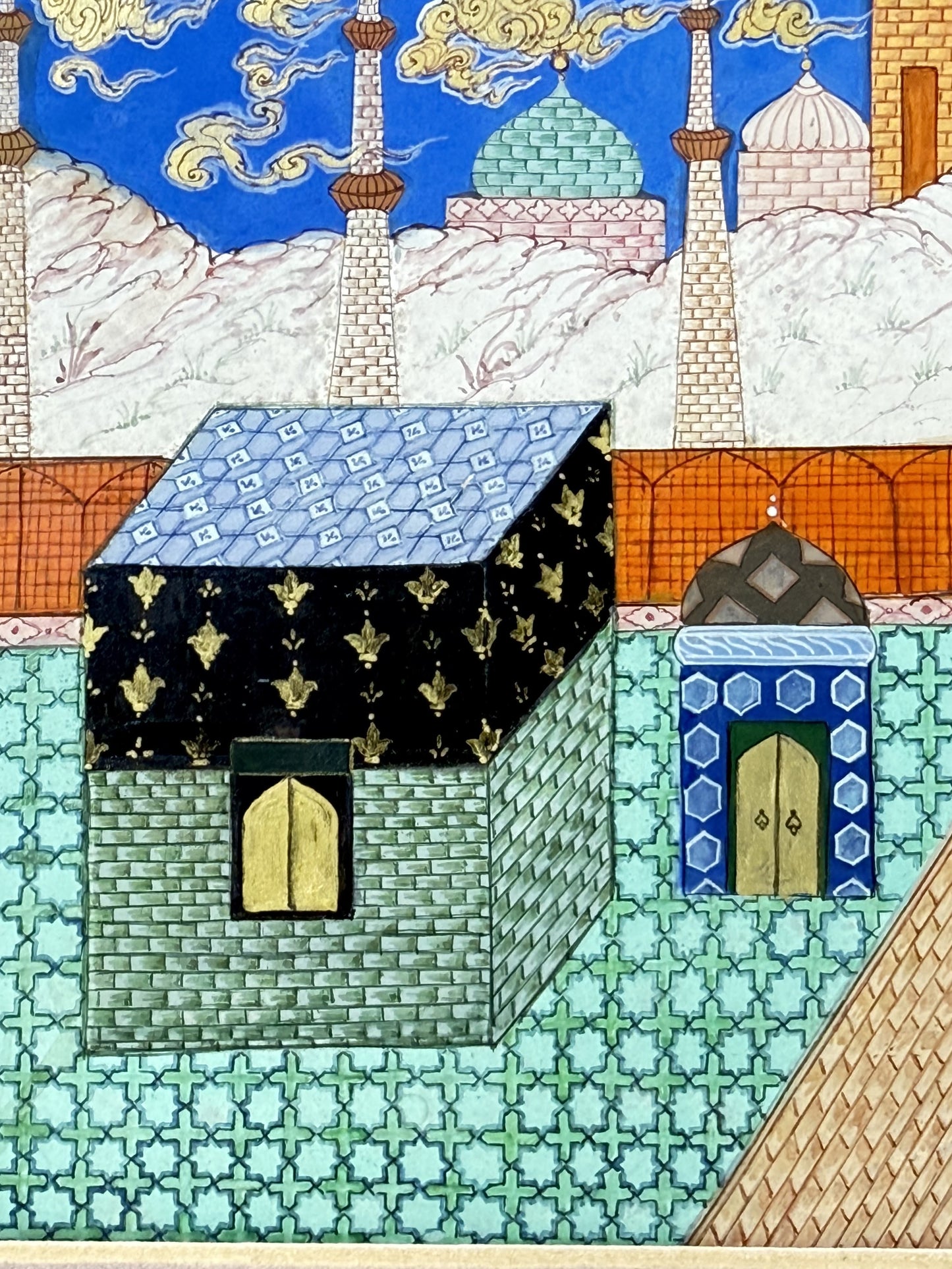 Detail: the Kaaba draped in its black kiswa with gold motifs and a blue-and-white patterned roof, its gold door set in a green stone wall, standing on a turquoise star-and-cross tiled courtyard with white minarets and a green dome behind - Mi'raj: The Night Journey, Kamal al-Din Ghotb.