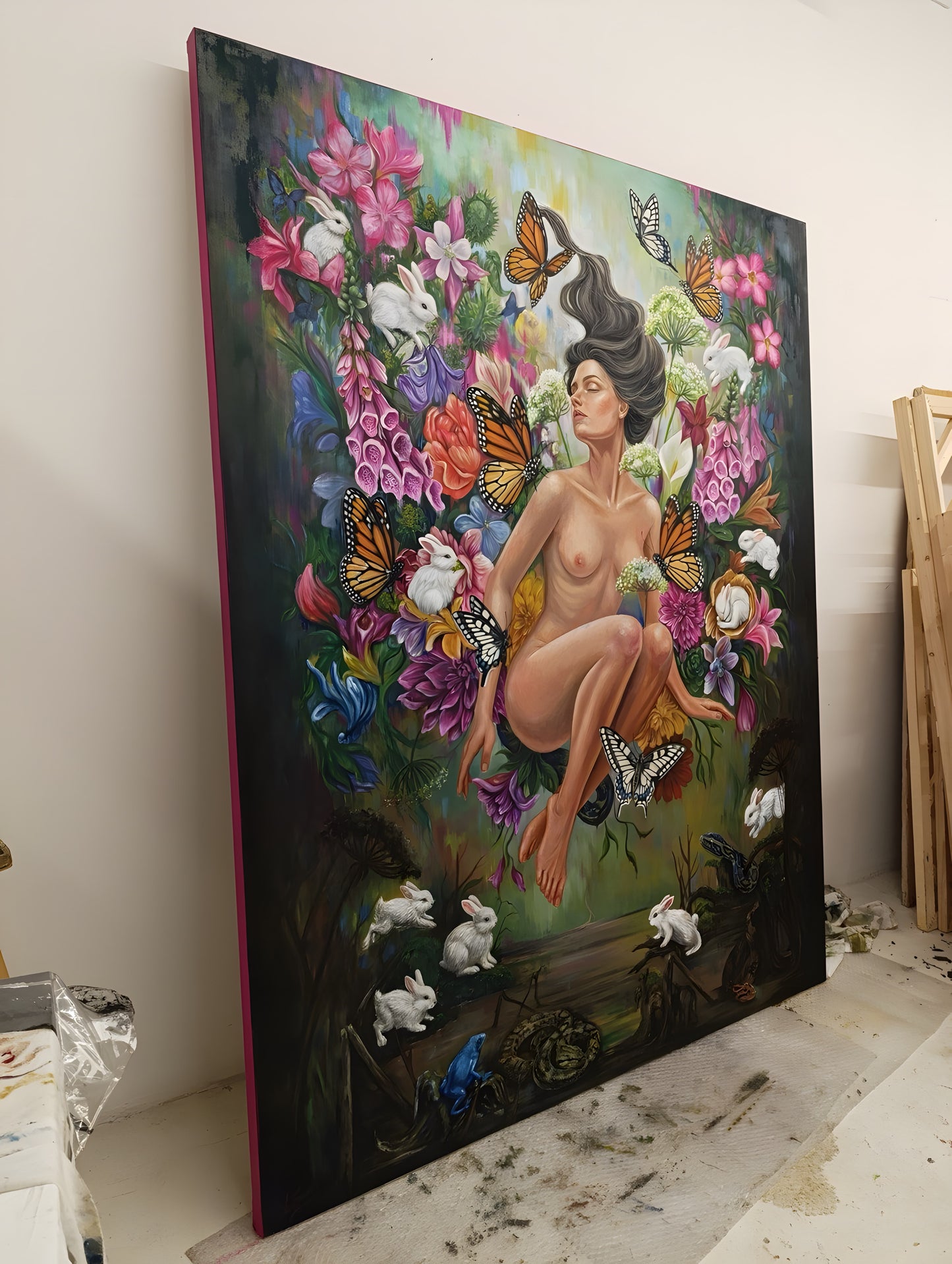 Studio photo: the large original oil painting Ecstasy in a Temporary Paradise, 140x180 cm on stretched canvas, shown upright against the studio wall