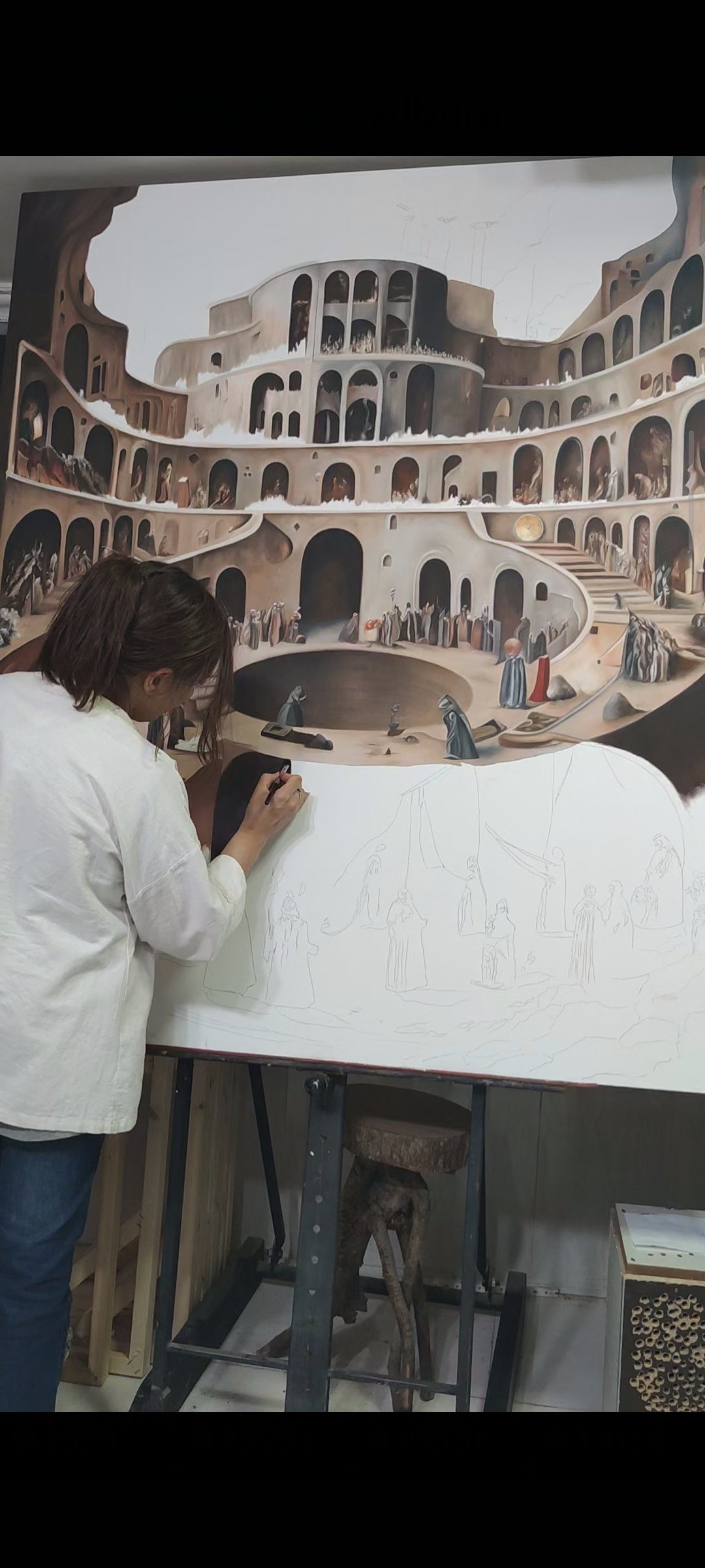 Melina Ghaemi at work on Why 12? in her studio, painting the lower section of the canvas where the figures are still pencil underdrawing.