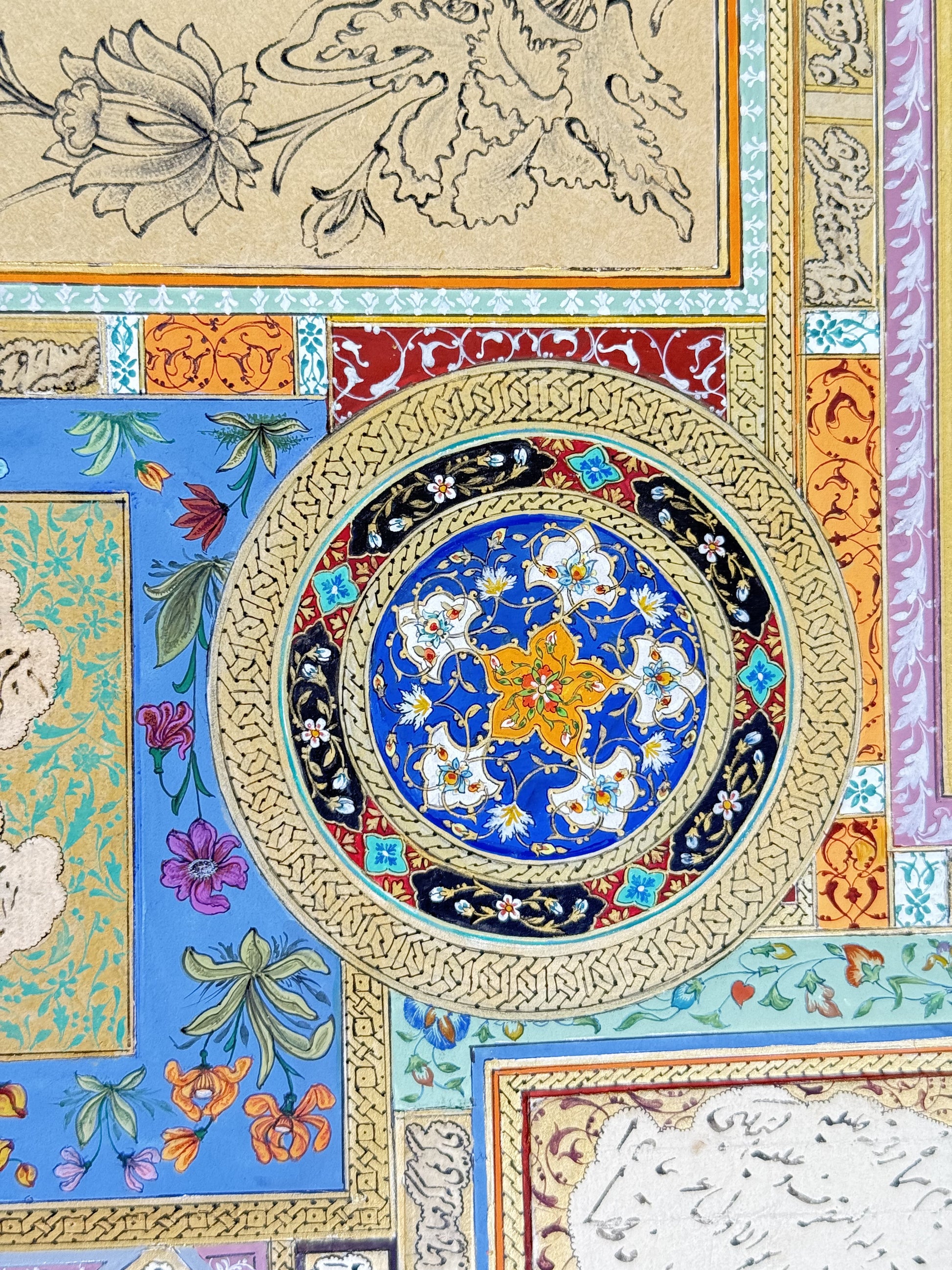 Detail of the gold shamseh medallion at the centre of the page - a lapis blue field carrying a six-petalled orange rosette among white and turquoise lotus blossoms on gold vine scrolls, ringed by black cartouches of gold leaf sprays, a red band of arabesque with turquoise quatrefoils, and an outer band of gold knotwork. Muraqqa': The Gold Shamseh, Kamal al-Din Ghotb.