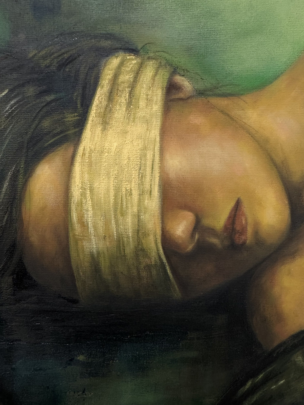 Close detail of Second Skin by Phaedra: the blindfolded face in warm skin tones with the canvas weave visible