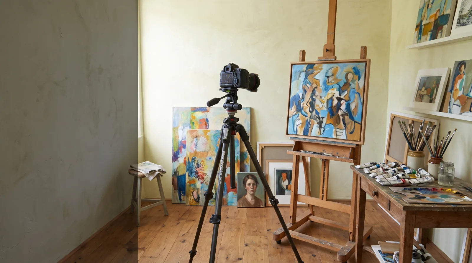 An artist studio with original paintings ready to be photographed for submission